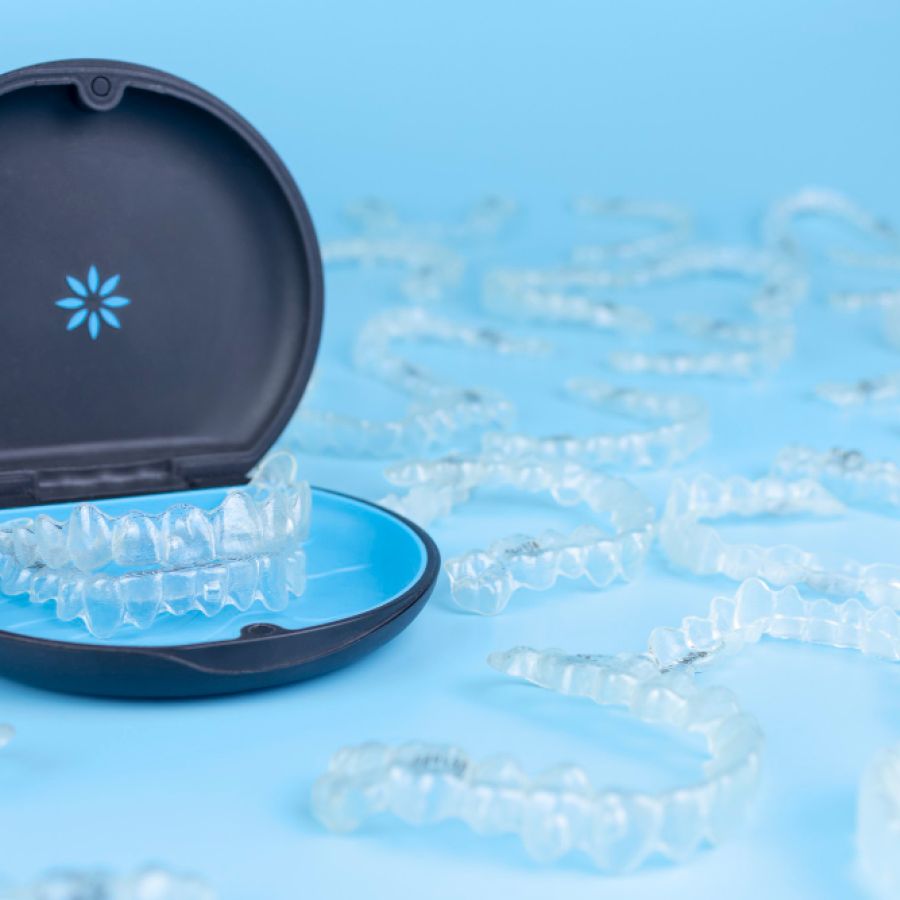 Removable transparent retainers in a black container